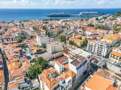 an aerial view of a city with buildings and the ocean at Funchal Heritage Studio in Funchal