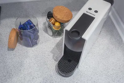 a toaster on a counter next to two bowls of food at Sao Pedro Central Flat by Atlantic Holiday in Funchal