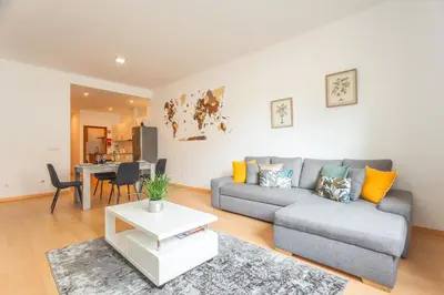a living room with a couch and a table at Sao Pedro Central Flat by Atlantic Holiday in Funchal