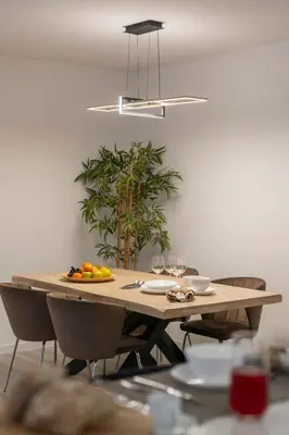a wooden table with a plate of fruit on it at Uptown II by An Island Apart in Funchal