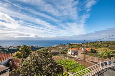 a view of the ocean from a house at SunRise Vila in Estreito da Calheta