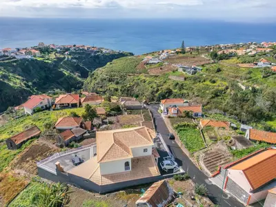 an aerial view of a house on a hill at SunRise Vila in Estreito da Calheta