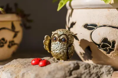 a small owl sitting on a table with two berries at GuestReady - A homely retreat in São Martinho in Funchal