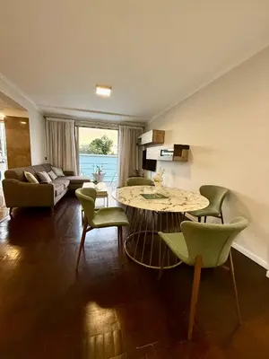 a living room with a table and chairs at Funchal Center Inn in Funchal