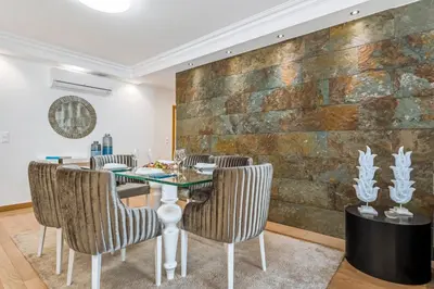 a living room with a wooden dresser and a doorway at White House Premium in Funchal
