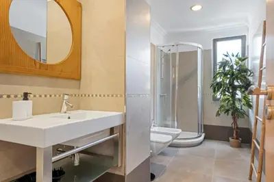 a white bedroom with a bed and a couch at White House Premium in Funchal