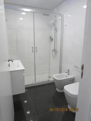 a bathroom with a shower and a toilet and a sink at Gold Center Funchal 103 in Funchal