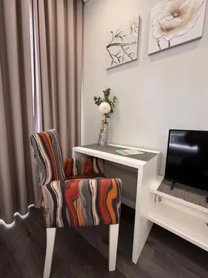 a room with a desk and a chair next to a computer at Gold Center Funchal 103 in Funchal