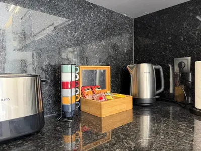 a kitchen with a counter top with a coffee maker at Gold Center Funchal 103 in Funchal