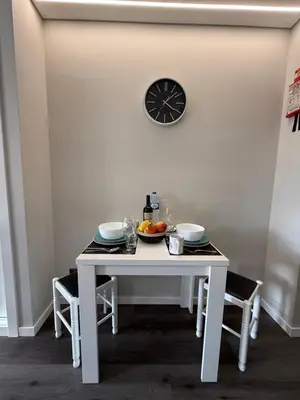 a white table with a plate of fruit on it at Gold Center Funchal 103 in Funchal