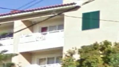 a building with a street sign in front of it at Apartment superb in Funchal in Funchal