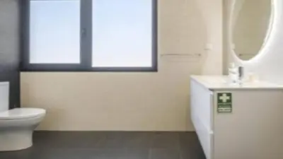 a bathroom with a toilet and a sink and a mirror at Apartment superb in Funchal in Funchal