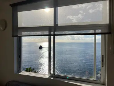a window with a view of the ocean at Апартаменты 303 - Studio in Funchal