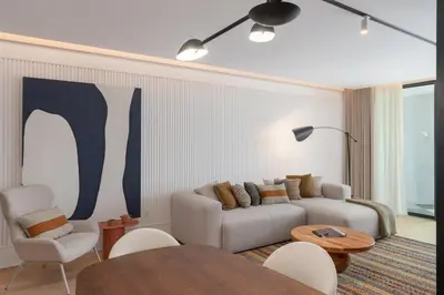 a living room with a couch and a table at Savoy Insular V by An Island Apart in Funchal