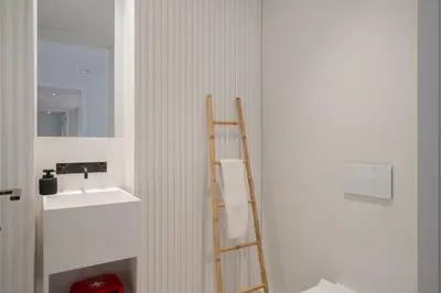 a bathroom with a ladder next to a sink at Savoy Insular V by An Island Apart in Funchal