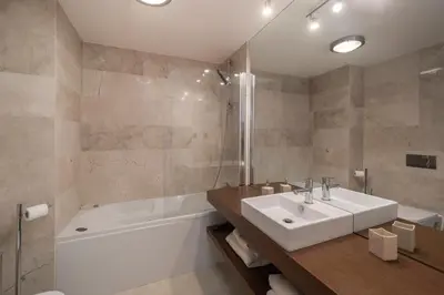 a bathroom with a sink and a bath tub at Madalenas II by An Island Apart in Funchal