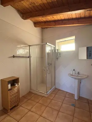 a bathroom with a shower and a sink at Casa Rochinha in Aljezur