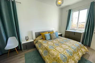 a bedroom with a bed and a window at Faria House by Horizon View Madeira in Funchal
