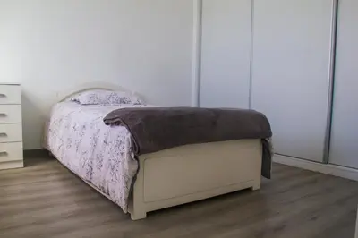 a bedroom with a bed and a dresser at Faria House by Horizon View Madeira in Funchal