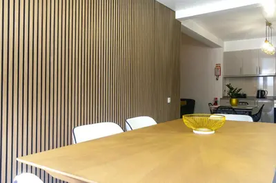 a wooden table with a yellow bowl on top of it at Faria House by Horizon View Madeira in Funchal