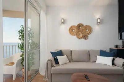 a living room with a couch and a table at Incredible sea view Apartamento do Mar I in Funchal