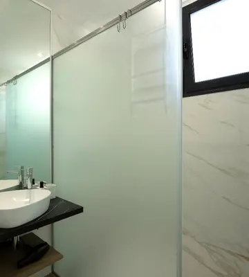a bathroom with a sink and a mirror at Marco 4 Seasons- Summer in Arco da Calheta