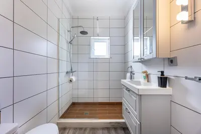a bathroom with a shower and a sink at Casa Cool in Aljezur