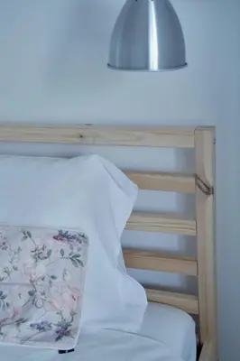 a white bed with a pillow and a lamp at Carvalhal Old Town in Funchal