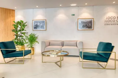 a waiting room with a couch and chairs and a table at Funchal Acqua Blue 8E, a Home in Madeira in Funchal