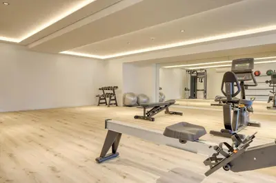 a gym with several treadmills and cardio machines at Funchal Acqua Blue 8E, a Home in Madeira in Funchal