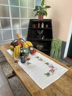 a table with a bunch of fruit and drinks on it at Casa Mary Bela's in Ponta do Sol