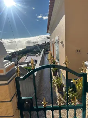 a balcony with a view of a walkway at Casa Mary Bela's in Ponta do Sol