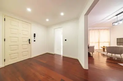 an empty living room with a door and a couch at Home in Funchal in Funchal