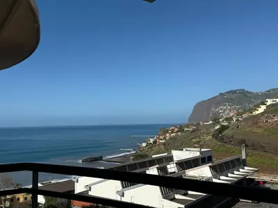 a view of the ocean from a balcony at BelleMar Vacations in Funchal