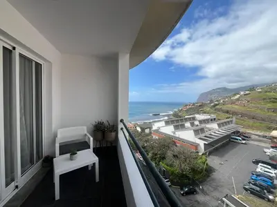 a balcony of a building with a view of the ocean at BelleMar Vacations in Funchal
