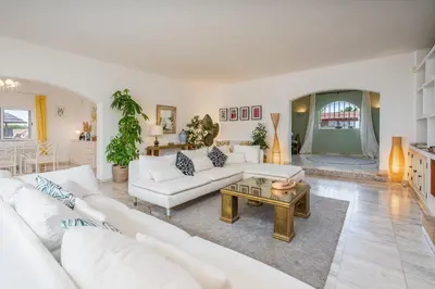 a living room with white couches and a coffee table at Spacious villa with sea view, tennis & golf garden #1963 in Alagoas