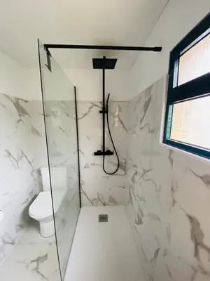 a bathroom with a shower and a toilet at Dani House - Porto Moniz Escape in Porto Moniz