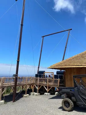 a wooden bridge with people standing on it at Dani House - Porto Moniz Escape in Porto Moniz