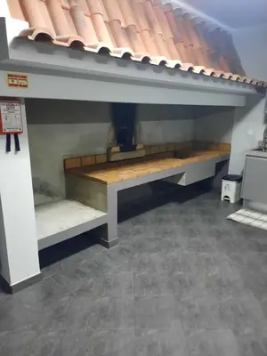 a bench under a roof in a room at Rose Sun House in Ponta do Sol