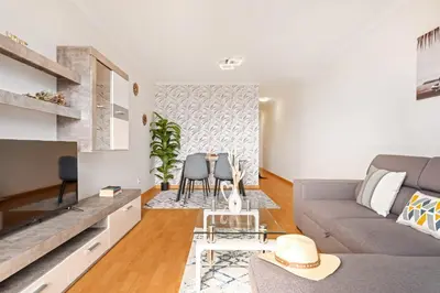 a living room with a couch and a table at Sunflower Living by Homie in Caniço