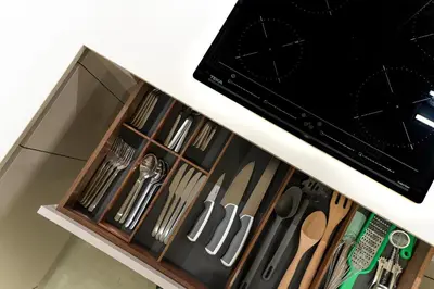 a drawer filled with knives and other kitchen utensils at Safira Suites 101 in Funchal