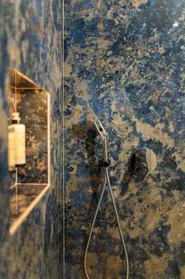 a bathroom with a shower with a mirror on the wall at Safira Suites 201 in Funchal