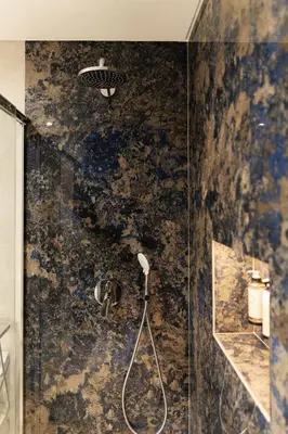 a bathroom with a shower with a glass door at Safira Suites 201 in Funchal