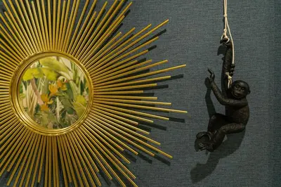 a statue of a monkey hanging from a wand at Safira Suites 202 in Funchal
