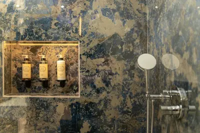 three bottles of wine on a wall in a bathroom at Safira Suites 301 in Funchal