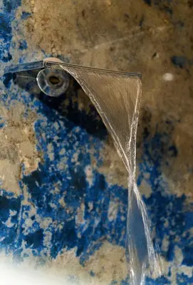 a stream of water coming out of a water fountain at Safira Suites 301 in Funchal