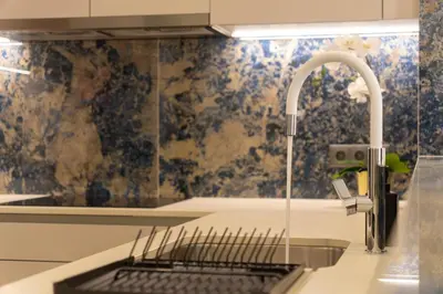 a kitchen with a sink and a faucet at Safira Suites 302 in Funchal