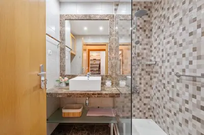 a bathroom with a sink and a mirror at Lux Garden View by Homie in Funchal