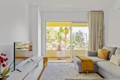 a living room with a couch and a tv at Lux Garden View by Homie in Funchal