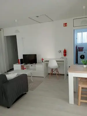 a living room with a couch and a table at Casa Ponte in Ponta do Sol